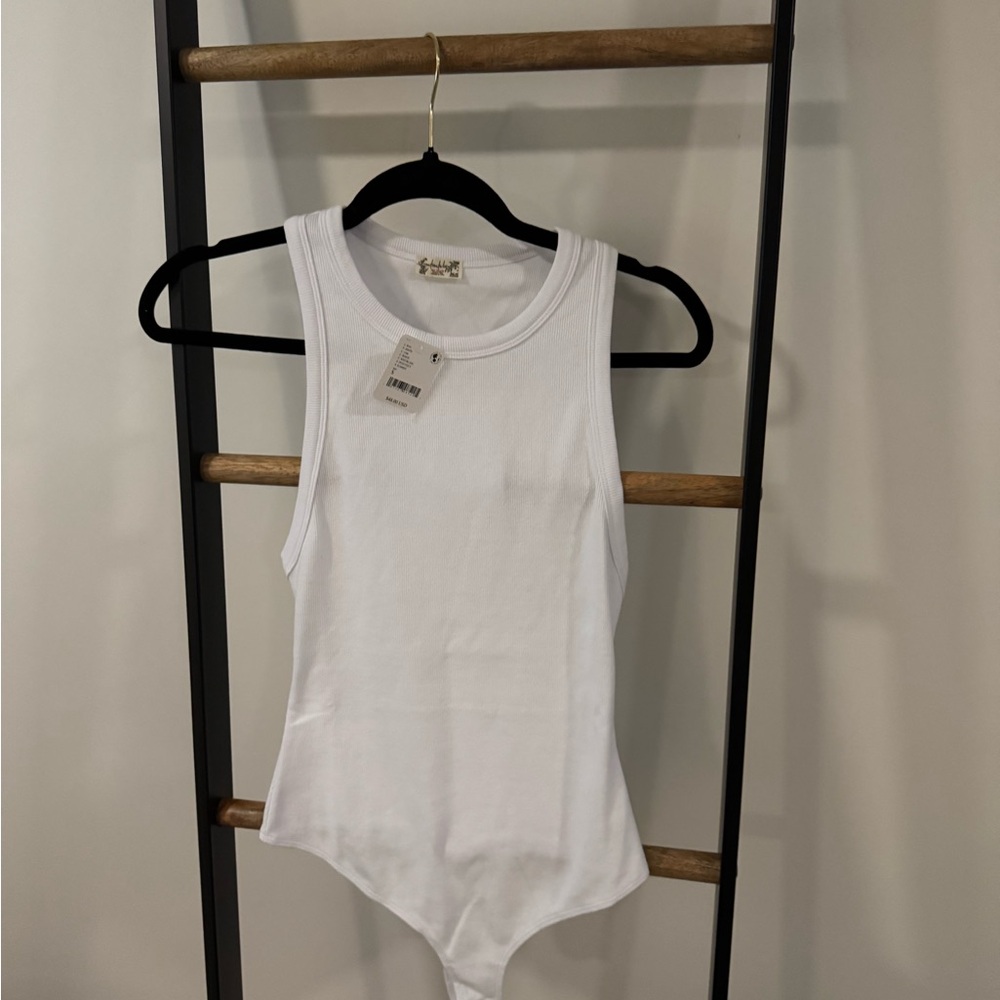 White bodysuit with a slight sheen #bodysuit
WHITE
